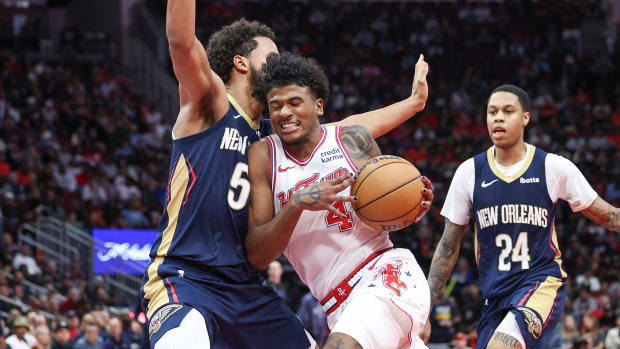 Rockets guard Jalen Green (4) drives with the ball as New Orleans Pelicans forward Jeremiah Robinson-Earl (50) defends during the fourth quarter at Toyota Center.